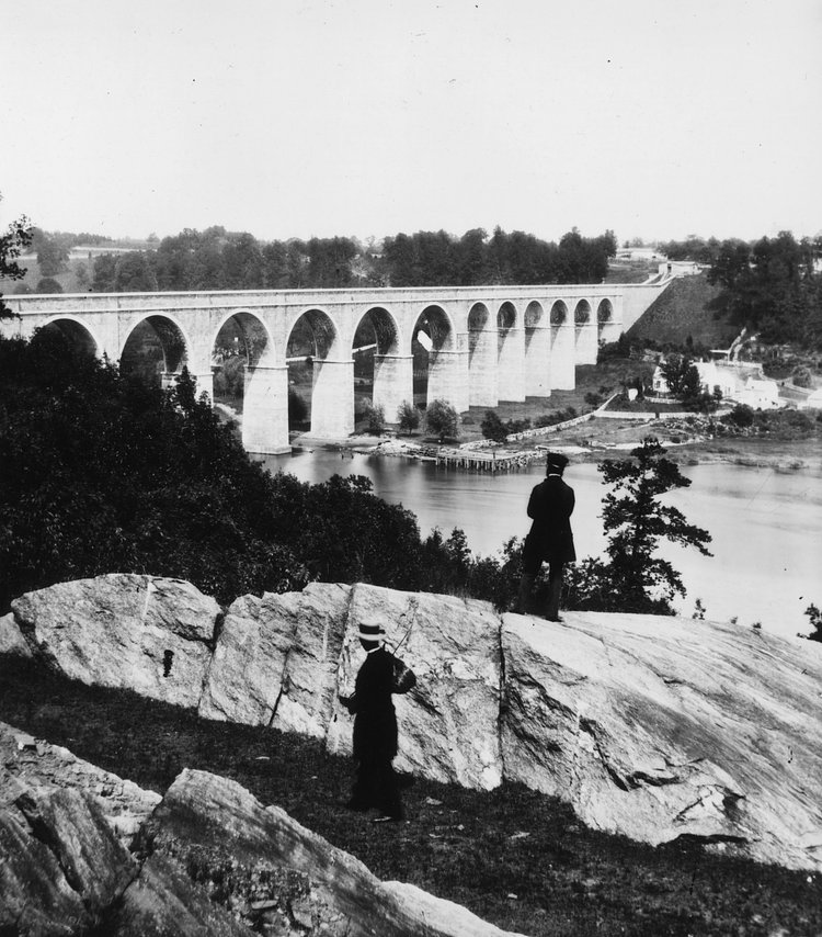 January 01, 1859. The High Bridge over the Harlem River, New York. Designed by American engineer John B Jervis as part of the Croton Aqueduct carrying water to New York City.