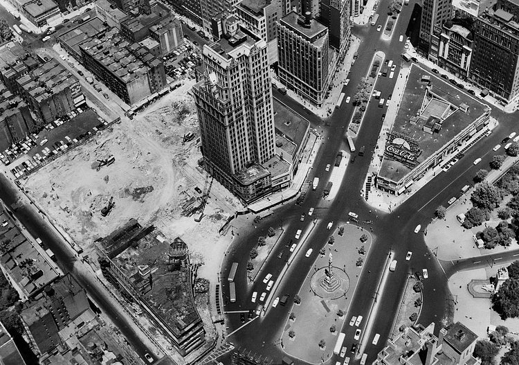 June 21, 1954: Plans to build on Columbus Circle required demolition of 1819 Broadway, a tower of offices that would be “the tallest building ever to come down anywhere in the world,” according to H. B. Mack, president of Wreckers and Excavators Inc. The demolition, which displaced pigeons and others, was to make space for the New York Coliseum, a convention center that stood there from 1956 till 2000, when the Time Warner Center moved in.