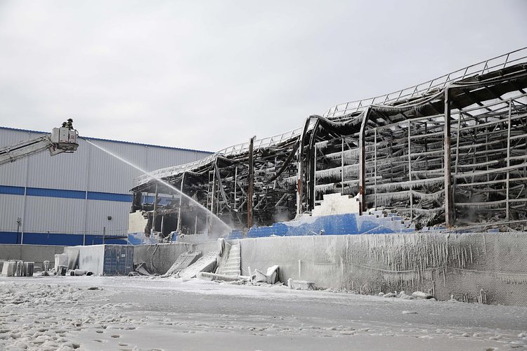 Firefighters continued pouring water on the remains of a 7-alarm fire in a warehouse on the Williamsburg waterfront