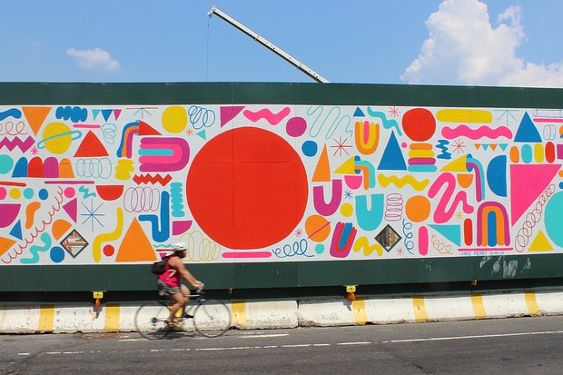 Lead artist Mike Perry's mural shows off his bold, bright style, which usually includes a lot of colorful squiggles.