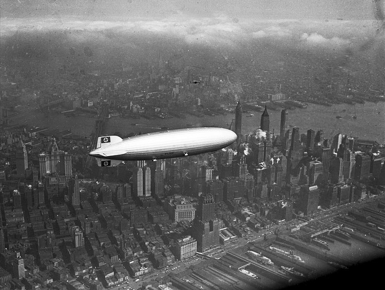 LZ 129 Hindenburg built by the Zeppelin company flies over Manhattan on May 6, 1937. A few hours later, the ship burst into flames in an attempt to land at Lakehurst, New Jersey