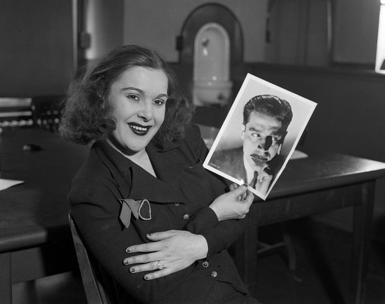 Mob Moll, 1937: Showgirl Marion 'Kiki' Roberts had ties to the mob being the mistress of the late Prohibition-era gangster John (Legs) Diamond, who was the main distributor of illegal alcohol in Manhattan in the late 1920s. Here, the mob moll, who was once in bed with the mobster while he was shot, plants a kiss on her next victim, actor Jack La Rue!