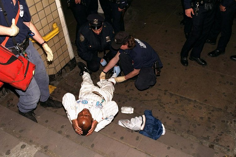 1990's: One of two shooting victims is treated by paramedics at the 34th St. and 8th Avenue subway station following a violent 1996 incident.