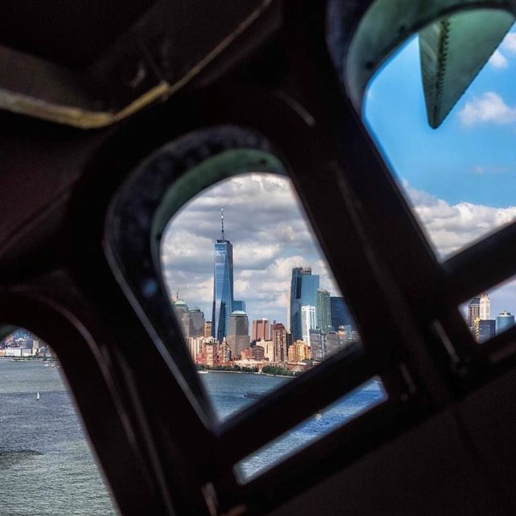 New York City from inside Statue of Liberty. Photo via @kylenowinski_photos #viewingnyc #newyorkcity #newyork