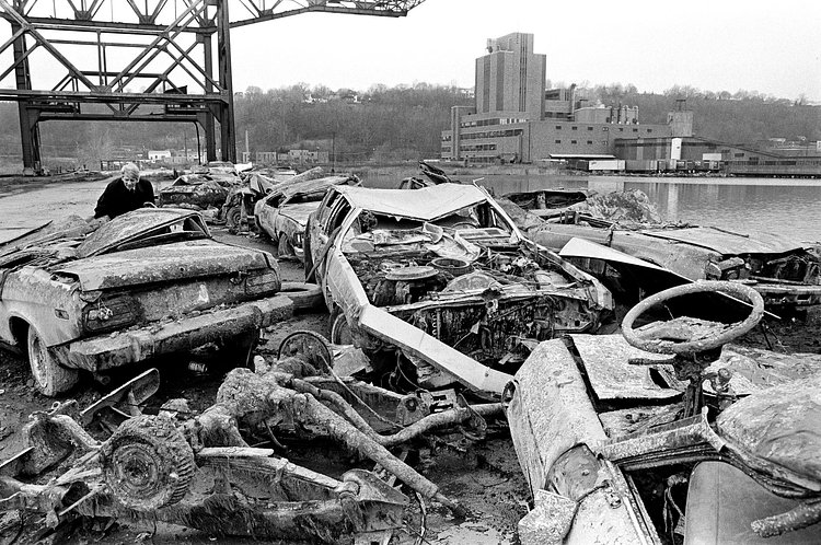 Some of a total of 16 cars left at a pier. Dec. 12, 1984.