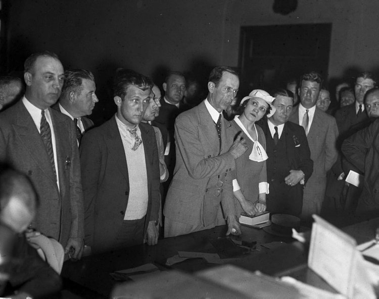 Mob Moll, 1933: Lottie Coll, the widow of slain gangster Vincent 'Mad Dog' Coll, looks on as she, along with Joseph Ventre and Albert Guarino, are arraigned for killing an innocent bystander during a robbery in 1933.
