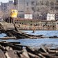 A homemade submarine lies half-submerged in the mud of Coney Island Creek in Brooklyn. The vessel became lodged in the muck shortly after embarking on a failed treasure hunting expedition in the 1970s.