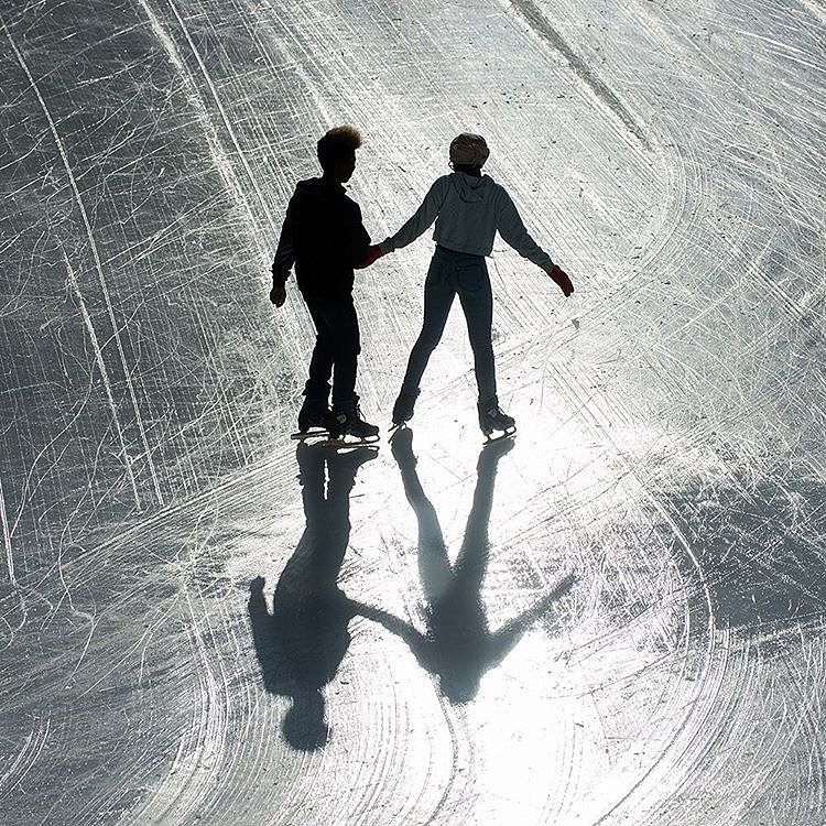 Ice skaters at @brookfieldplny in Manhattan this afternoon. To celebrate our millionth @Instagram follower, we gave @bryanthomasphoto an unusual #nytassignment: photograph festive scenes in New York. He rode the Staten Island Ferry, strolled through the West Village. and captured New Yorkers taking advantage of warmer weather in the Financial District. To see more of @bryanthomasphoto’s photos from New York, visit the link in our profile. #🎉 