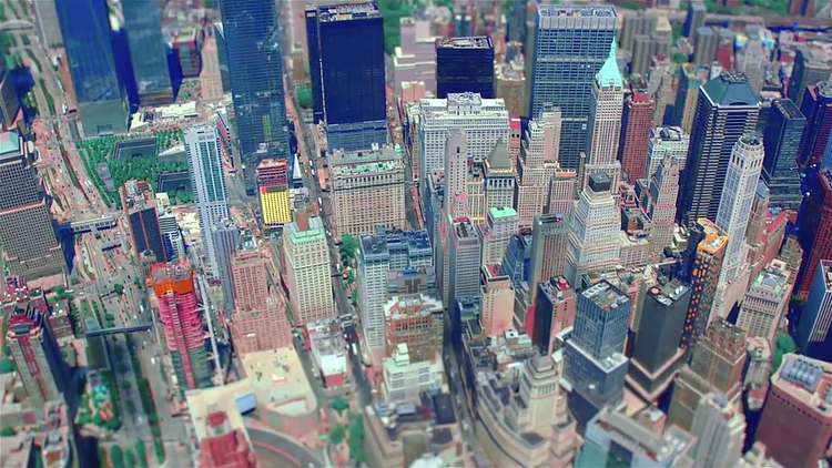 The video chronicles a day in New York City, beginning with an aerial shot depicting Lower Manhattan skyscrapers. 50 West by Time Equities, JAHN and SLCE Architects is visible at the bottom left. The two footprints where the Twin Towers at the World Trade Center stood are evident just north of this residential tower. 
