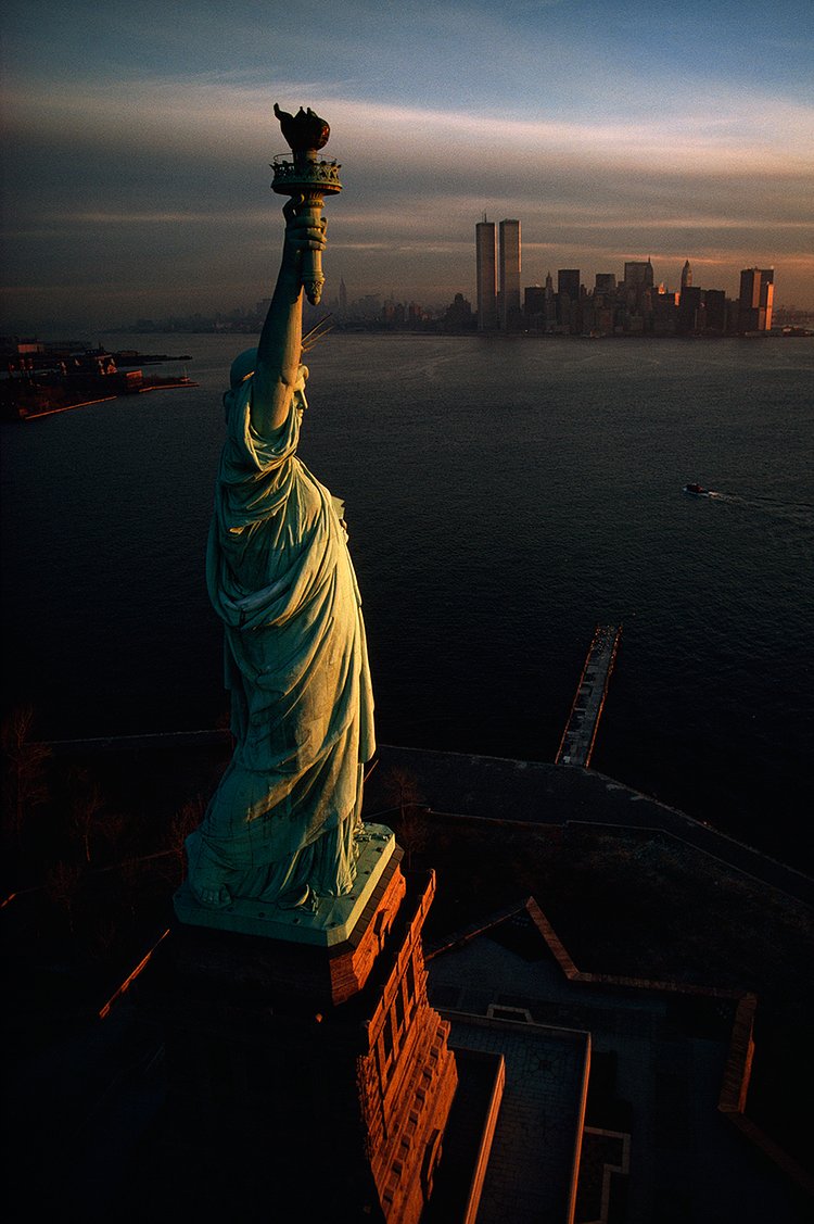 The Statue of Liberty hails dawn over New York Harbor in 1978.