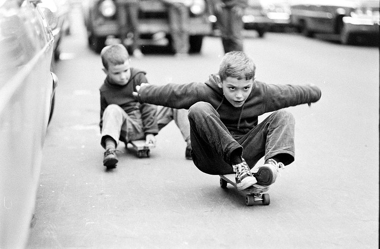 A young boy challenges a pigeon (not pictured) to a game of Skate Or Die.