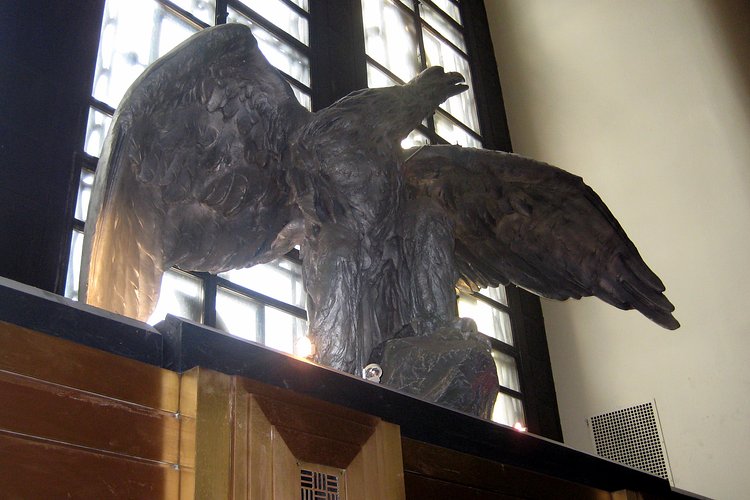 NYC: Brooklyn Public Library - Central Library - Brooklyn Daily Eagle | This cast-zinc eagle, on view above the entrance to the Central Library, is the distinctive emblem of Brooklyn's historic newspaper, <i>The Brooklyn Daily Eagle</i>.  Kindly loaned by the Brooklyn Historical Society, the eagle signals Brooklyn Public Library's position as the preeminent repository for materials on the newspaper.  Weighing over 300 pounds, the eagle was sculpted in 1892 by the Piccirilli Brothers and cast at the Hecla Iron Works in Williamsburg.  The sculpture, originally perched above the doorwawy of the <i>Eagle's</i> office at Johnson and Washington Streets, was removed when the building was demolished in 1955 and became the property of the Brooklyn Historical  Society.  It was was moved to the sculpture garden of the Brooklyn Museum, until it was restored and returned to the Historical Society in 1989.

The Brooklyn Public Library (BPL) is the fifth largest public library system in the United States.  The main branch, the <a href="http://www.flickr.com/photos/wallyg/180616072/">Central Library</a>, is located next to <a href="http://www.flickr.com/photos/wallyg/sets/72157594185702272/">Prospect Park</a>, just off <a href="http://www.flickr.com/photos/wallyg/180403457/in/set-72157600164126901/">Grand Army Plaza</a>, where Eastern Parkway and Flatbush Avenue intersect.  Each year, more than 1.5 million people use the central library, which contains more than 1.5 million books, magazines, and multimedia materials.

The site for the Central Library was chosen in 1905 to replace the small outmoded structure on Montague Street.  Foundations, however, were not laid until 1914 and construction dragged until 1937.  Finally opened on February 1, 1941, the $5 million neoclassic building, designed by Alfred Morton Githens and Francis Keally, resembles an open book, with the spine at the main entrance on the plaza, and the two wings running along the avenues.  The stair terrace and concave entrance, adorned with impressive <a href="http://www.flickr.com/photos/wallyg/2415511956/">Art Deco reliefs</a> by Thomas Hudson Jones and C. Paul Jennewin, were designed to reflect the ellipitcal configuration of the plaza.

The Central Library was designated a landmark by the New York City Landmarks Preservation Commission in 1997.

National Register #01001446