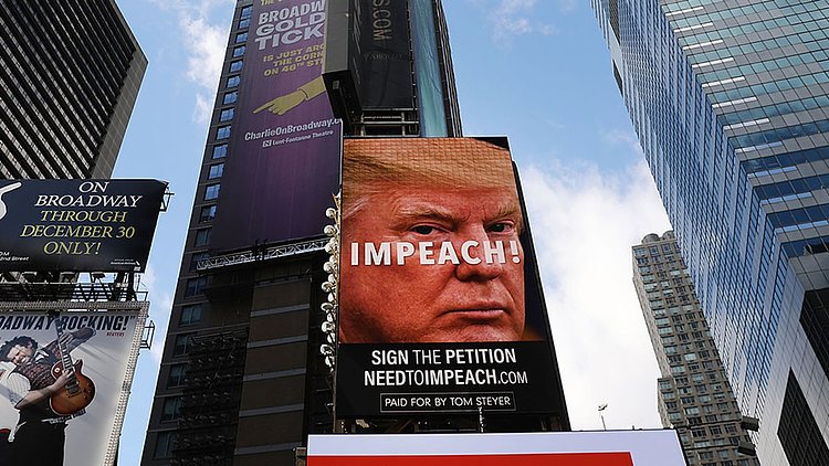 Giant billboard in Times Square calling from Donald Trump's resignation