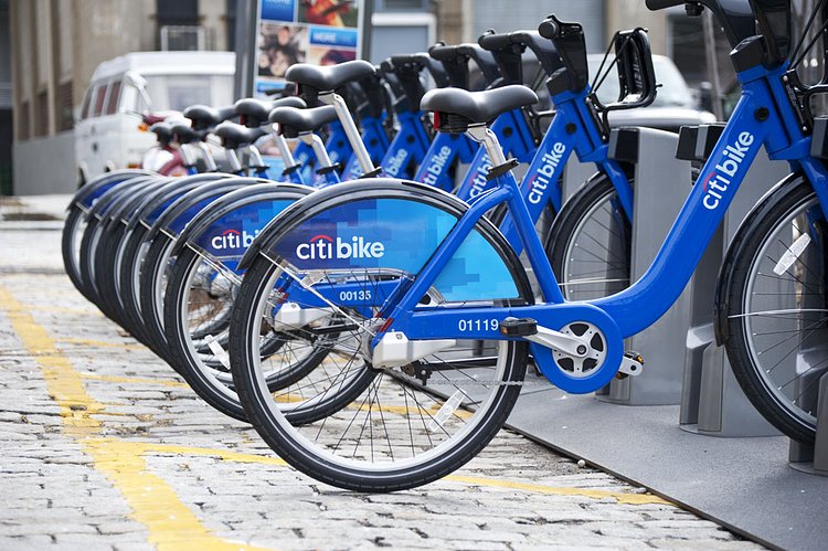 Citi bikes lined up at the Brooklyn Navy Yard | Citi bikes lined up at The Brooklyn Navy Yard a modern industrial park in a historical setting. With tenants representing a variety of industries like construction, theatrical set design, computer and office supplies, contracting, refrigerated distribution facilities, media communications and promotions, motor overhauling, and metal fabrication, the Navy Yard is capable of handling any type of business with a planned Multi-story Green Industrial Facility and New Green Manufacturing Plant.