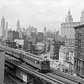 The Third Avenue elevated train rumbles across lower Manhattan, early 1900's.