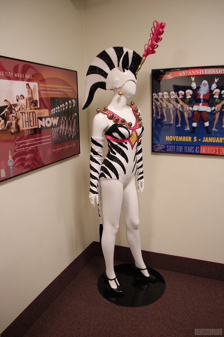 Rockettes Costume | Built in 1932, Radio City Music Hall is a prime example of art deco architectural style that has withstood the test of time. With tons of gold, reflective surfaces and geometric design, walking through the venue is a bit like stepping back in time. Most of the fixtures, furniture and ornamentation are original, and any replacements are exact replicas of how the theater looked 80 years ago.

Read more here: <a href="https://viewing.nyc/i-braved-a-walkthrough-of-radio-city-music-hall-meant-for-tourists/" rel="nofollow">viewing.nyc/i-braved-a-walkthrough-of-radio-city-music-ha...</a>