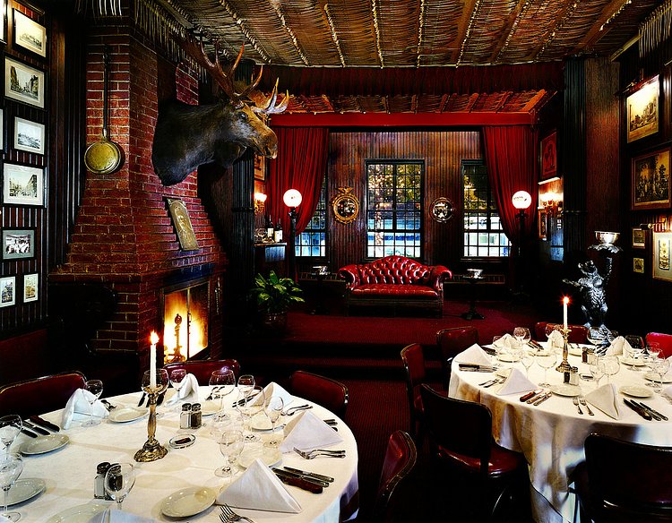 Bull Moose Room | This quintessentially American room was named after President Theodore Roosevelt, and is ideal for executive or private dinners, small cocktail parties and wine tastings. The room features a working fireplace and its richly paneled walls are lined with period photographs and sundry Americana.