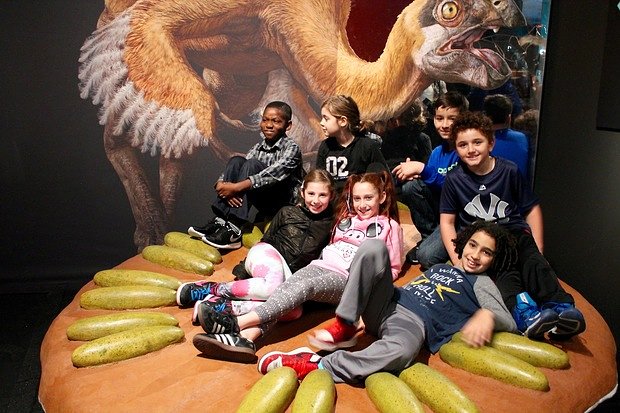 This tyrannosaur, a cousin of the T-Rex, is both ferocious and covered in proto-feathers, scientists said.