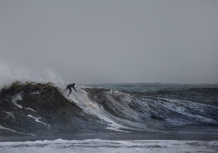 Tony Farmer was one of three surfers riding waves at Rockaway Beach during a Nor'easter storm in December of 2014. Waters rushed out to document the surfers and caught this image of Farmer riding a 10 to 12-foot wave. "He rode it all the way," she said. "It was one of those magic moments."