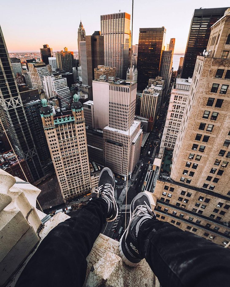 sitting upon one of the earliest skyscrapers ever built, which was the tallest in the world from 1913 to 1930