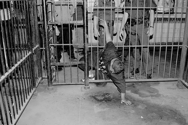 1990's: Nice try! A man trying to avoid paying subway fare is caught in the act after getting stuck in the gate while attempting to sneak through. Emergency services had to be called to cut him free.