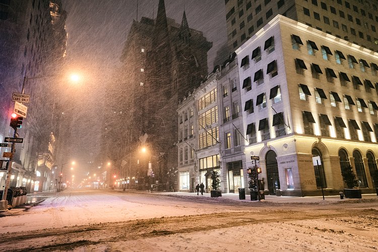New York City - Snow - Winter Storm Juno - Empty 5th Avenue - Henri Bendel | Juno: The first snowstorm of 2015 in New York City.

---

(Note: My <a href="http://www.amazon.com/gp/product/1440339589/ref=as_li_tl?ie=UTF8&amp;camp=1789&amp;creative=9325&amp;creativeASIN=1440339589&amp;linkCode=as2&amp;tag=nyththle0e-20&amp;linkId=ER6GYT5FRYNMEPLF" rel="nofollow">New York photography book</a> released worldwide in stores/online recently and has photos similar to this  [full info below])

---

I have been photographing New York City during snowstorms at night for the past 5 years. When it comes to experiencing <a href="http://nythroughthelens.com/tagged/snow" rel="nofollow">New York City in the snow</a>, I relish the challenge. The more gusty, snowy, and brutal the storm, the more of a chance that I will be out in it traipsing around New York City with my cameras in tow.

When I heard that the MTA was suspending all transit service (and most vehicles) at 11 pm, I made the decision to take the train up to the Upper East Side prior to 11 pm to deposit myself up there with the intention of walking from the Upper East Side to Times Square and then walking the several miles back to the Lower East Side (whew!!).

The streets were eerily empty.

Emptier than they are usually at night during snowfall. Since there was a ban on all vehicles aside from snow plows and emergency services, there were practically no cars at all on the streets. Even taxis were banned from the streets!

I walked in the middle of avenues and streets that are usually teeming with cars.

There was an eerie sense of calm.

It was magical.


---

This is part of a post that I posted to my NYC photography blog. If you are curious enough to look at the photos there, here is the link to the post:

<a href="http://nythroughthelens.com/post/109291619025/new-york-city-snow-winter-storm-juno-i" rel="nofollow">New York City - Winter Storm Juno</a>


----

* As mentioned above - My New York City coffee table book that released in stores/online worldwide recently.

 Tons of information about my <a href="http://www.amazon.com/gp/product/1440339589/ref=as_li_tl?ie=UTF8&amp;camp=1789&amp;creative=9325&amp;creativeASIN=1440339589&amp;linkCode=as2&amp;tag=nyththle0e-20&amp;linkId=ER6GYT5FRYNMEPLF" rel="nofollow">New York photography book</a> with sample pages (including where to order and what stores are carrying it) here:

<a href="http://nythroughthelens.com/post/92873566010/ny-through-the-lens-the-book-i-am-super" rel="nofollow">NY Through The Lens: A New York Coffee Table Book</a>
---


View my New York City photography at my website <a href="http://nythroughthelens.com/" rel="nofollow">NY Through The Lens</a>.

View my Travel photography at my travel blog: <a href="http://travelinglens.me/" rel="nofollow">Traveling Lens</a>.

Interested in my work and have questions about PR and media? Check out my:

<a href="http://nythroughthelens.com/about" rel="nofollow">About Page</a> | <a href="http://nythroughthelens.com/PR" rel="nofollow">PR Page</a> | <a href="http://nythroughthelens.com/media" rel="nofollow">Media Page</a>