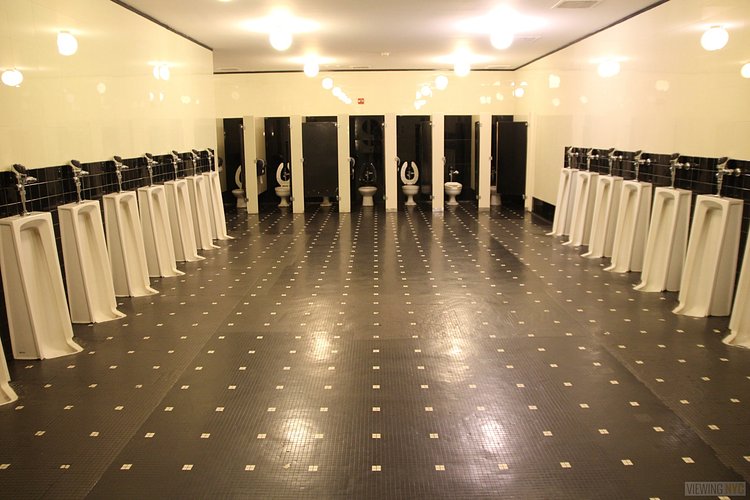 Original Men's Room Fixtures | Built in 1932, Radio City Music Hall is a prime example of art deco architectural style that has withstood the test of time. With tons of gold, reflective surfaces and geometric design, walking through the venue is a bit like stepping back in time. Most of the fixtures, furniture and ornamentation are original, and any replacements are exact replicas of how the theater looked 80 years ago.

Read more here: <a href="https://viewing.nyc/i-braved-a-walkthrough-of-radio-city-music-hall-meant-for-tourists/" rel="nofollow">viewing.nyc/i-braved-a-walkthrough-of-radio-city-music-ha...</a>