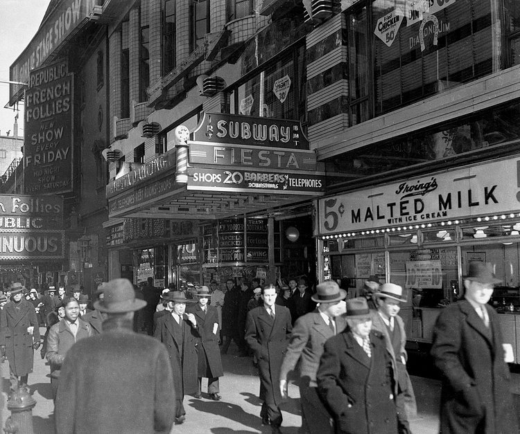 This view shows the 42nd Street subway entrance and store fronts in New York City on April 2, 1940.