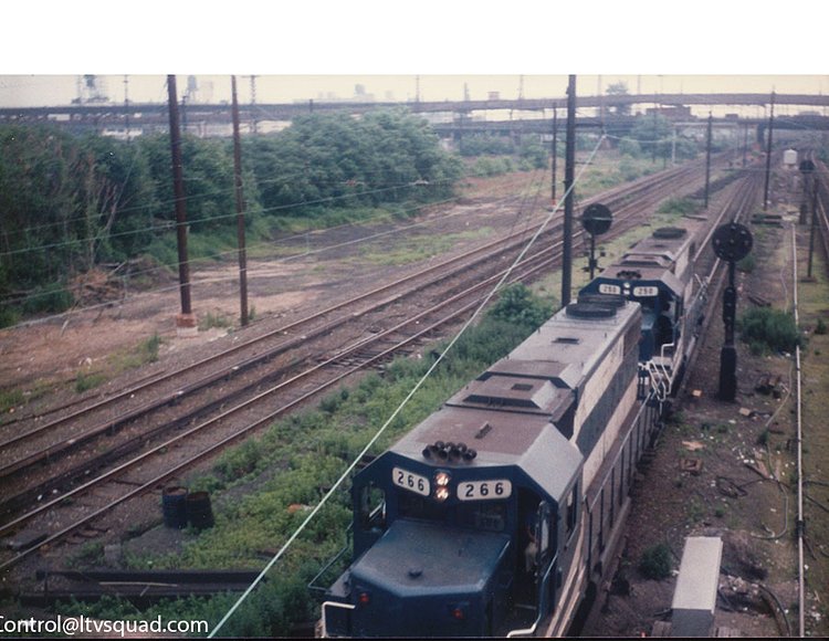 A set of LIRR ‘GP-38-2’ locomotives entering the ‘Mainline’ Cutoff at Thomson Avenue in 1989 (Queens blvd is in the background – the mainline cutoff is merely the ramp from the montauk cutoff into Harold interlocking)