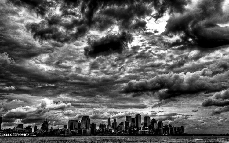 Stormy Gotham | Storm clouds over Lower Manhattan. Taken from Hoboken, NJ. 3 Exposures, +2 EV, 0 EV, -2 EV lighting was tweaked in LightRoom, Photoshop was not used. 

<a href="http://www.bighugelabs.com/onblack.php?id=3656101668&amp;size=large" rel="nofollow">View Large On Black</a>

