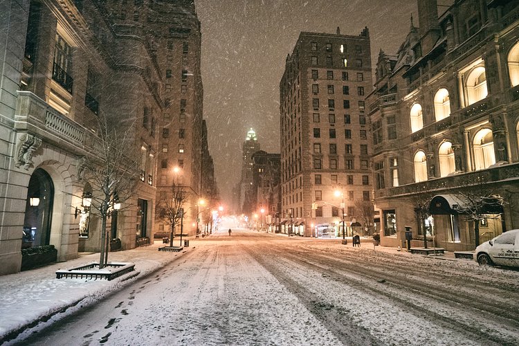 New York City - Snow - Winter Storm Juno - Madison Avenue Empt | Juno: The first snowstorm of 2015 in New York City.

---

(Note: My <a href="http://www.amazon.com/gp/product/1440339589/ref=as_li_tl?ie=UTF8&amp;camp=1789&amp;creative=9325&amp;creativeASIN=1440339589&amp;linkCode=as2&amp;tag=nyththle0e-20&amp;linkId=ER6GYT5FRYNMEPLF" rel="nofollow">New York photography book</a> released worldwide in stores/online recently and has photos similar to this  [full info below])

---

I have been photographing New York City during snowstorms at night for the past 5 years. When it comes to experiencing <a href="http://nythroughthelens.com/tagged/snow" rel="nofollow">New York City in the snow</a>, I relish the challenge. The more gusty, snowy, and brutal the storm, the more of a chance that I will be out in it traipsing around New York City with my cameras in tow.

When I heard that the MTA was suspending all transit service (and most vehicles) at 11 pm, I made the decision to take the train up to the Upper East Side prior to 11 pm to deposit myself up there with the intention of walking from the Upper East Side to Times Square and then walking the several miles back to the Lower East Side (whew!!).

The streets were eerily empty.

Emptier than they are usually at night during snowfall. Since there was a ban on all vehicles aside from snow plows and emergency services, there were practically no cars at all on the streets. Even taxis were banned from the streets!

I walked in the middle of avenues and streets that are usually teeming with cars.

There was an eerie sense of calm.

It was magical.


---

This is part of a post that I posted to my NYC photography blog. If you are curious enough to look at the photos there, here is the link to the post:

<a href="http://nythroughthelens.com/post/109291619025/new-york-city-snow-winter-storm-juno-i" rel="nofollow">New York City - Winter Storm Juno</a>


----

* As mentioned above - My New York City coffee table book that released in stores/online worldwide recently.

 Tons of information about my <a href="http://www.amazon.com/gp/product/1440339589/ref=as_li_tl?ie=UTF8&amp;camp=1789&amp;creative=9325&amp;creativeASIN=1440339589&amp;linkCode=as2&amp;tag=nyththle0e-20&amp;linkId=ER6GYT5FRYNMEPLF" rel="nofollow">New York photography book</a> with sample pages (including where to order and what stores are carrying it) here:

<a href="http://nythroughthelens.com/post/92873566010/ny-through-the-lens-the-book-i-am-super" rel="nofollow">NY Through The Lens: A New York Coffee Table Book</a>
---


View my New York City photography at my website <a href="http://nythroughthelens.com/" rel="nofollow">NY Through The Lens</a>.

View my Travel photography at my travel blog: <a href="http://travelinglens.me/" rel="nofollow">Traveling Lens</a>.

Interested in my work and have questions about PR and media? Check out my:

<a href="http://nythroughthelens.com/about" rel="nofollow">About Page</a> | <a href="http://nythroughthelens.com/PR" rel="nofollow">PR Page</a> | <a href="http://nythroughthelens.com/media" rel="nofollow">Media Page</a>
