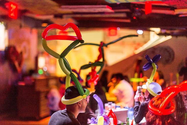 Many of the diners opt for balloon hats.
