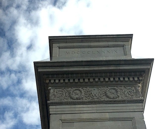 What is the Significance of the Roman Numerals on the Washington Square Arch? (western side of monument)