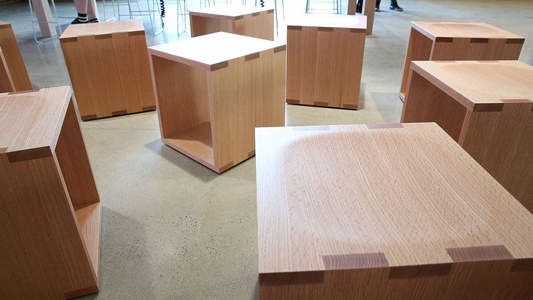 Customer seating is a series of wooden cubes.