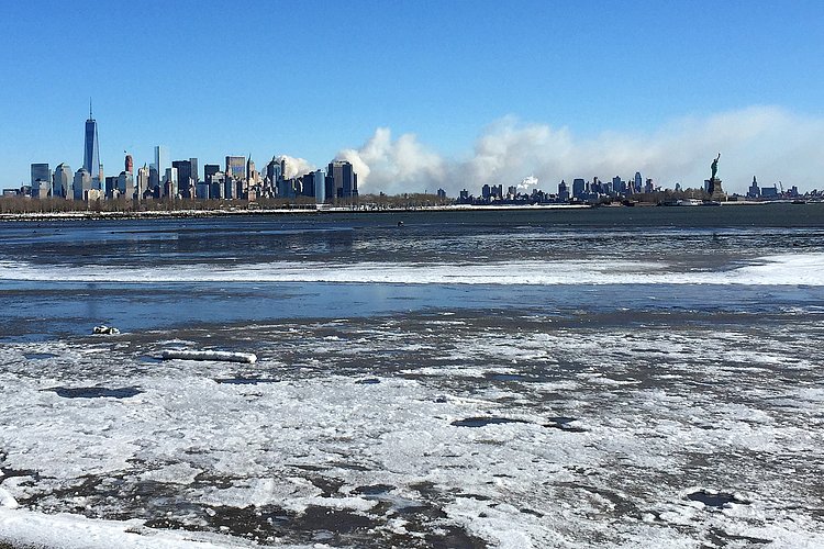 Firefighters continued pouring water on the remains of a 7-alarm fire in a warehouse on the Williamsburg waterfront