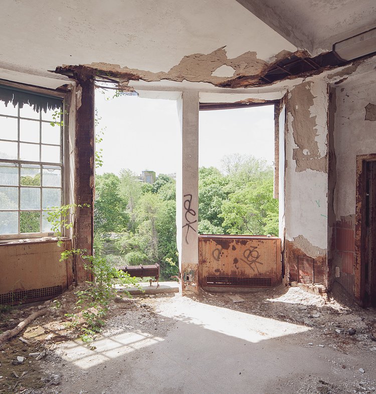 Two window fixtures had vanished, offering an unobstructed view of the surrounding woodlands.