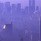 A purple haze enshrouds the city in 1989, with the Empire State Building in the foreground and the Twin Towers in the background.