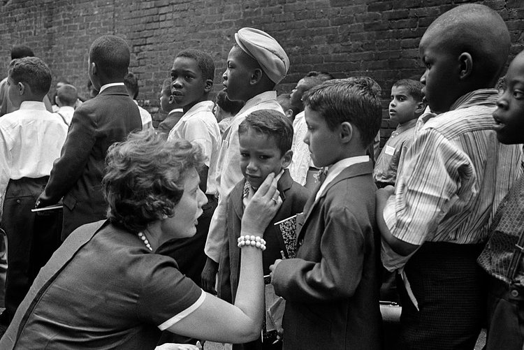 1960s - September 1961: A teacher, Sylvia Rahm, comforts a new student at Public School 145, on 105th Street between Columbus and Amsterdam Avenues.