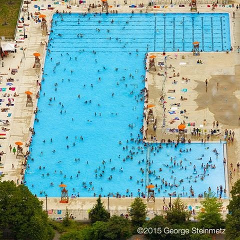 Photograph by George Steinmetz @geosteinmetz / @thephotosociety  McCarren Pool was the eighth of eleven giant pools built by the #WorksProgressAdministration and opened in 1936.  The city’s first outdoor public swimming pools were attached to baths and dated from the turn of the twentieth century; before that, there were floating baths in the Hudson and East Rivers.
