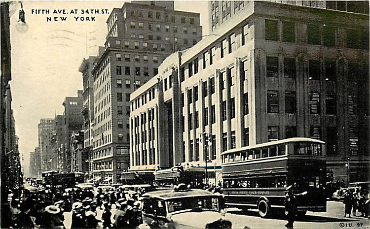 In just 20 years Fifth Avenue has changed dramatically. Looking south on Fifth Avenue from 34th Street in 1935, the Waldorf-Astoria is gone and the Empire State Building is in its place. The Empire State is directly behind the double deck Fifth Avenue bus. Pedestrian and vehicular traffic is substantial and in front of the bus a policeman deals with the congestion.