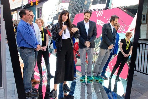 Artist Rachel Valdés Camejo, Times Square Alliance President Tim Tompkins and Times Square Arts Director Sherry Dobbin unveil "The Beginning of the End."