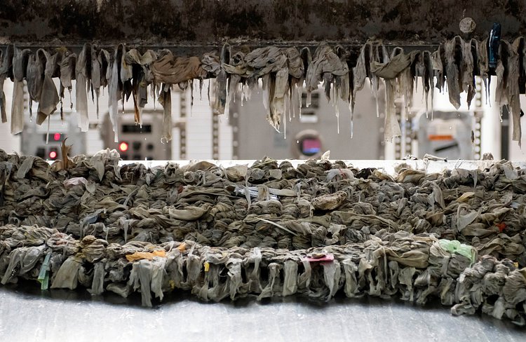 A mechanical rake at the Newtown Creek plant collecting solid waste, mostly wet wipes, for disposal.