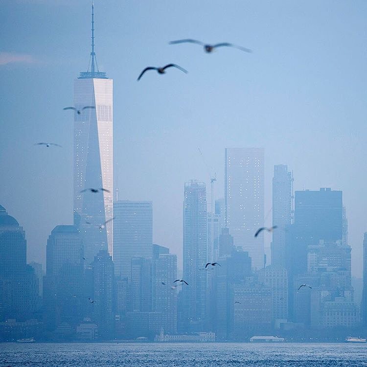 The photographer Karsten Moran captured a view of #Manhattan as the sun rose on this unseasonably warm December day. Karsten was riding the Staten Island Ferry en route to an early #nytassignment.