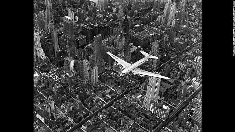 Life magazine photographer Margaret Bourke-White snapped this photo showing a DC-4 passenger plane flying over midtown Manhattan in 1939.