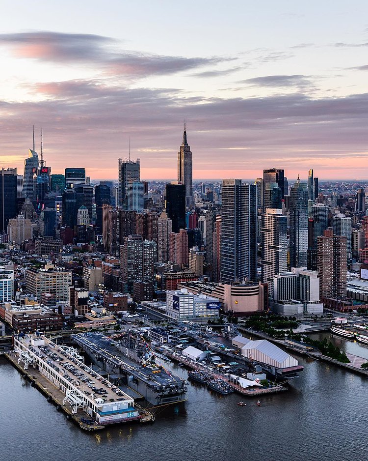 "The USS Kearsarge & USS Intrepid docked on the west side of Manhattan as the Empire State Building stands to attention during this morning's sunrise."