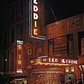 1946 Leon and Eddie's nightclub on 52nd street in Times Square (midtown) at night with patrons hanging out on the sidewalk.