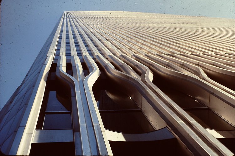 World Trade Centre 1986 | The original World Trade Center was designed by Minoru Yamasaki in the early 1960s using a tube-frame structural design for the twin 110-story towers. In gaining approval for the project, the Port Authority of New York and New Jersey agreed to take over the Hudson &amp; Manhattan Railroad which became the Port Authority Trans-Hudson (PATH). Groundbreaking for the World Trade Center took place on August 5, 1966. The North Tower  was completed in December 1970 and the South Tower was finished in July 1971. Construction of the World Trade Center involved excavating a large amount of material which was used in making Battery Park City on the west side of Lower Manhattan.