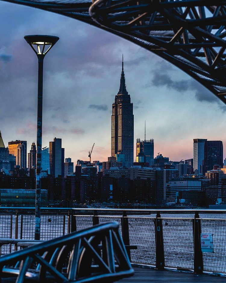 The Empire State shining from across the east river.