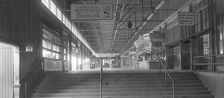 The interior of the St. George Terminal showing the entrance to the Brooklyn Ferry, circa 1927. (From the Collection of the Staten Island Museum) 