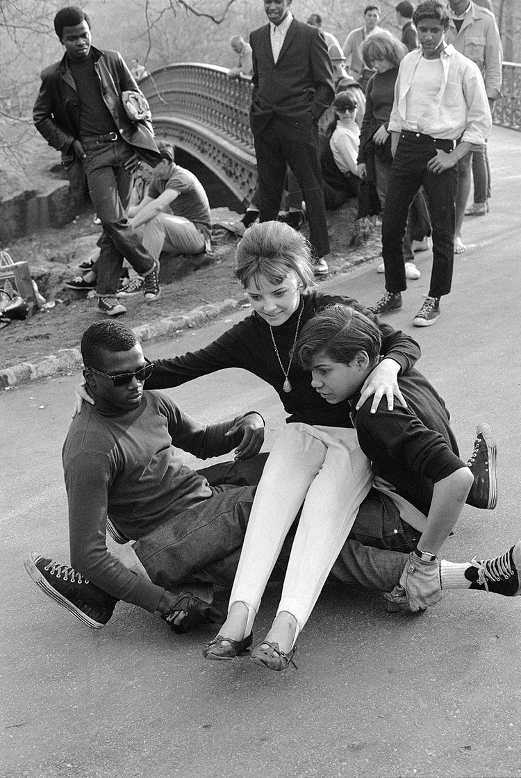 A group of friends configure a human skate throne in Central Park.
